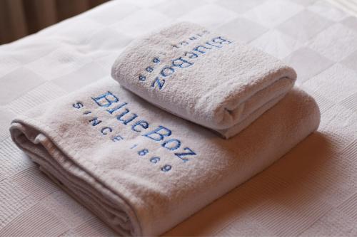 two towels sitting on top of a bed at Blue Boz Küçükköy in Ayvalık