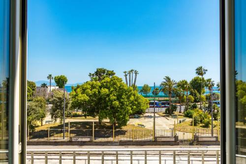 a view of a park from a window at Waterfront Riviera in Naples