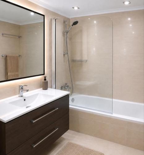 a bathroom with a tub and a sink and a shower at Turismo rural, San Sebastián,playa, parking privado in Azpeitia