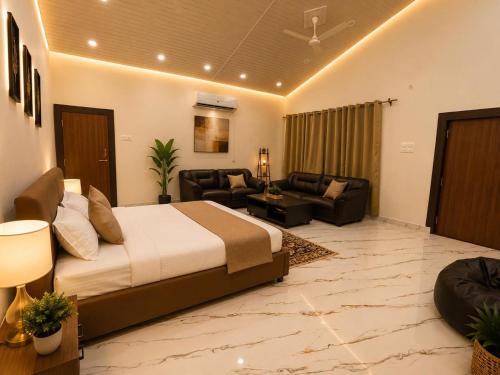 a bedroom with a bed and a living room at Vibhor peace cottage in Chitrakoot