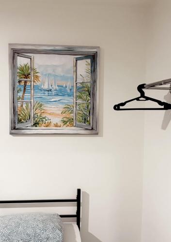 a bedroom with a window with a view of the ocean at Apartman City 2 With 2 Bedrooms and Free Parking in Negotin