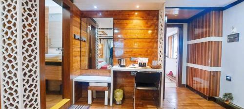 a bathroom with a sink and a mirror in a room at Hotel Rodali Residency in Guwahati