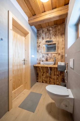 a bathroom with a toilet and a sink at Chata Michala in Dolný Kubín