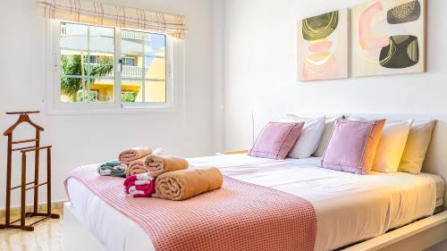 a bedroom with two beds with stuffed animals on it at Primavera apartment with heated pool in Palm-Mar