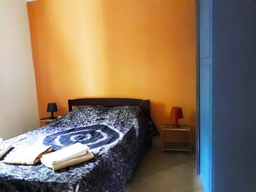 Кровать или кровати в номере Sanchaba Yellow Apartments