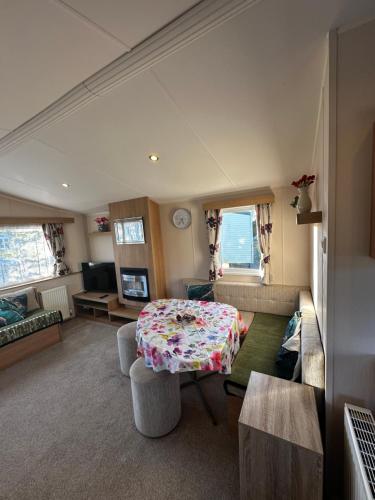 a living room with a table and a couch at The Springs 22-Sara in Winthorpe