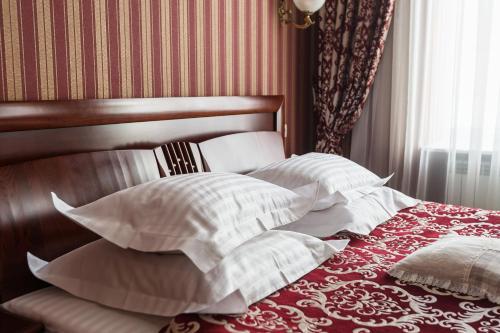 Katil atau katil-katil dalam bilik di Gostiny Dvor Hotel
