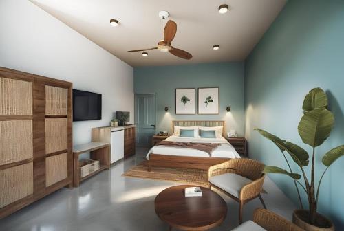 a bedroom with a bed and a ceiling fan at SUWA CHANDU - By Mountain Boutiques Luxury Collection in Mirissa