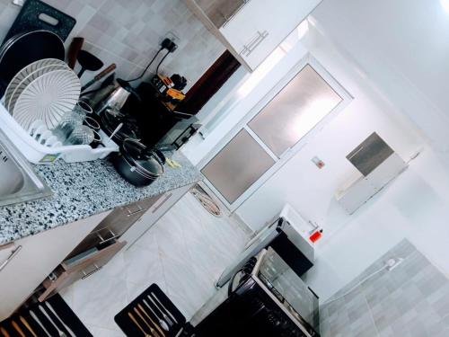 an aerial view of a kitchen with a fan on a counter at Open Haven One Bedroom Apartments in Ongata Rongai 