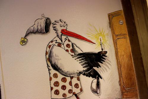 a drawing of a turkey on a wall at A la Maison Rouge Hôtel & Restaurant in Barr