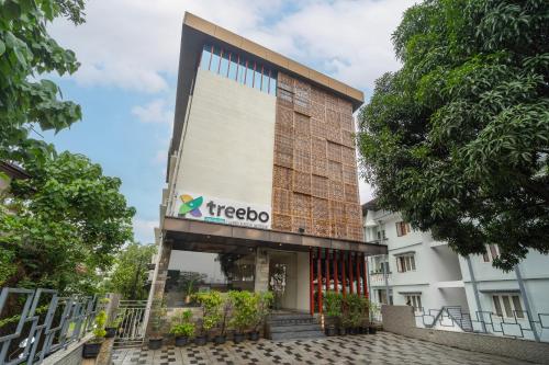 a rendering of the tesco building in the city at Treebo Premium Lavender Kochi Infopark in Cochin