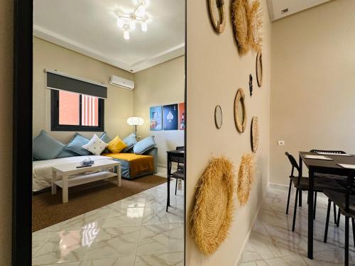 a living room with a couch and a dining room at Relax Family 01 - Cozy Entire Apartement in City Center in Ouarzazate