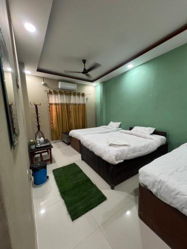เตียงในห้องที่ Bliss Hotel & SPA