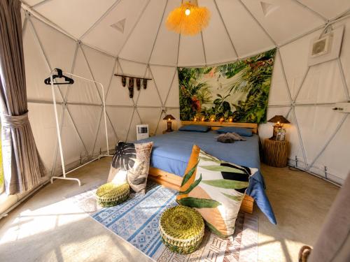 a bedroom with a bed in a tent at Vanara Resort in Ko Chang