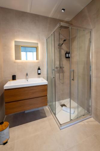 a bathroom with a shower and a sink at Eden Islands Marseille Prado in Marseille