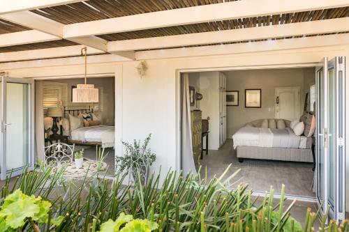 a room with two beds and a patio at 12 On Tindall in McGregor