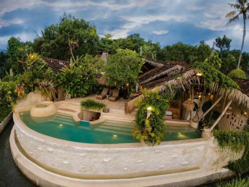an aerial view of a house with a swimming pool at HAVAN Villas - Yogyakarta in Jarakan