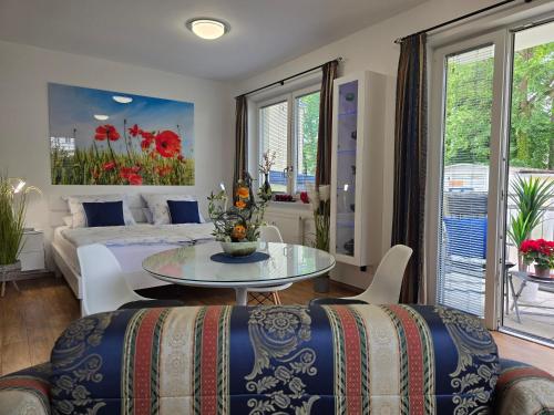 a bedroom with a bed and a table at Apartment Nordstern in Baabe