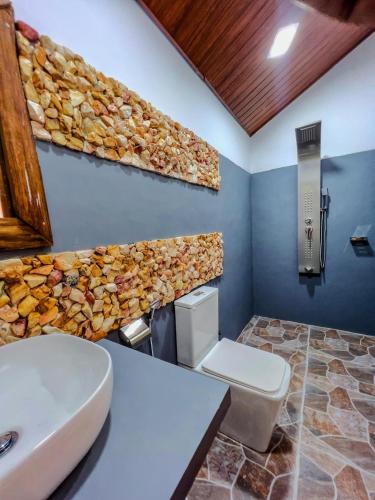 a bathroom with a sink and a toilet in a room at Forest River Escape Ella in Ella