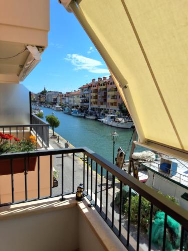 a balcony with a view of a river at AdryHouse in Grado