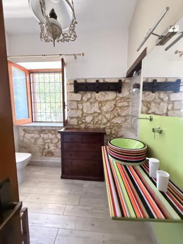 a bathroom with a sink and a toilet at Asparano in Ognina