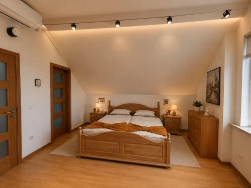 a bedroom with a bed and two dressers and a window at Paradiesli in Castelo de Penalva