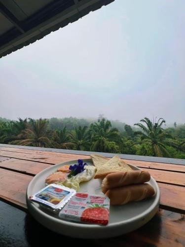 a tray of food on a table with a plate of food at Khaosok Malinglamping in Ban Thung Lang Tham