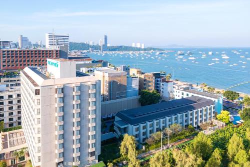 an aerial view of a city with a body of water at The Bayview Hotel Pattaya in Pattaya