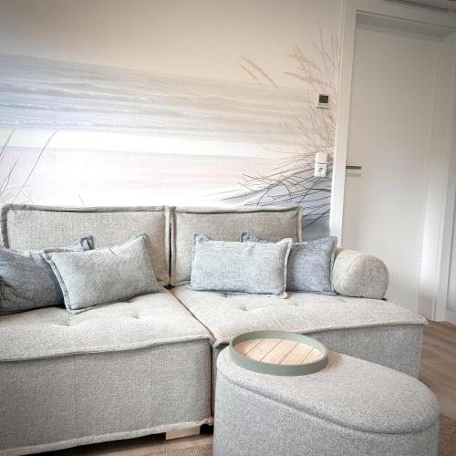 a living room with a couch and a table at Koje47 in Scharbeutz
