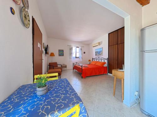 a room with a bed and a living room at millennium holiday in Castellammare del Golfo