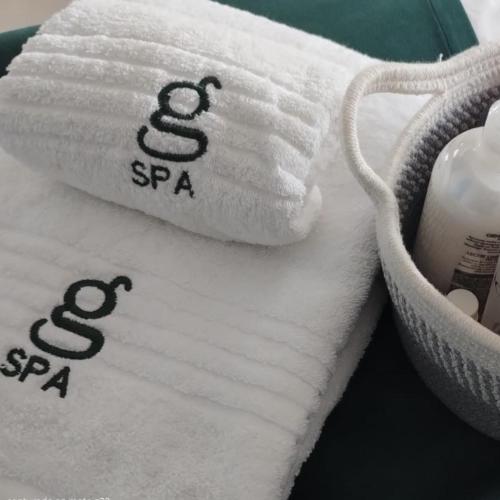 a close up of towels with the symbol of aries at Hotel Boutique Gualamba in General Pinedo