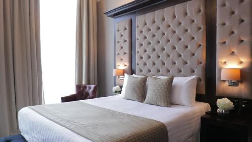a bedroom with a large bed and a window at Rizona Hotel-Narok in Narok