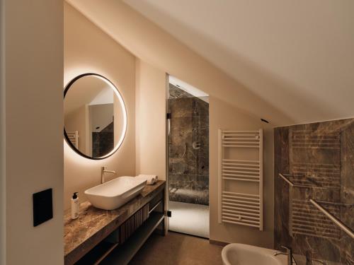 a bathroom with a sink and a mirror at Villa Giacomuzzi in Bolzano