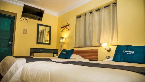 a hotel room with two beds and a piano at Mirador wayras in Cuzco