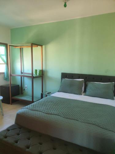 a bedroom with a large bed in a room at Villa Maze Suites - Canoa Quebrada in Aracati
