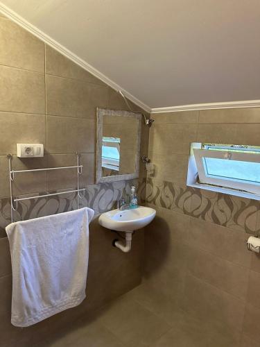 a bathroom with a sink and a mirror at Kelesina Apartment in Ulcinj