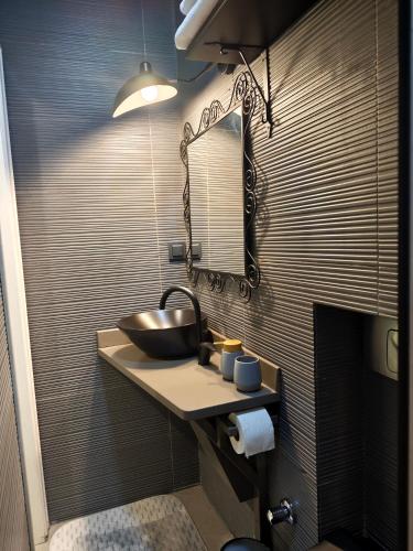 a bathroom with a sink and a mirror at Nar Adaevi in Bozcaada