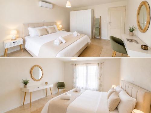 a white bedroom with a bed and a mirror at Daisy House Golden Beach Area in Potamiá