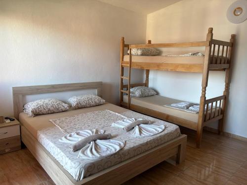 a bedroom with two bunk beds and a bed at Eki 2026 VIP in Donji Štoj