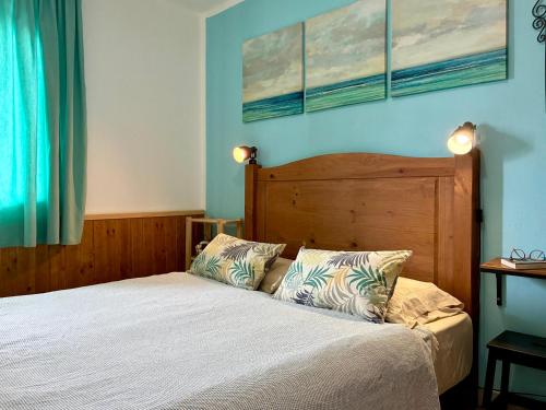 a bedroom with a bed with two pillows on it at Apartamento Los Lagos Renovated New Kitchen & More in El Cotillo
