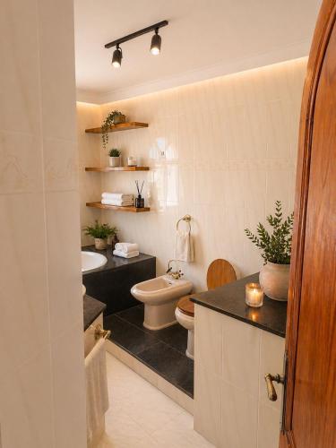 a bathroom with a toilet and a sink at Excelente villa With pool ibiza in Santa Gertrudis de Fruitera
