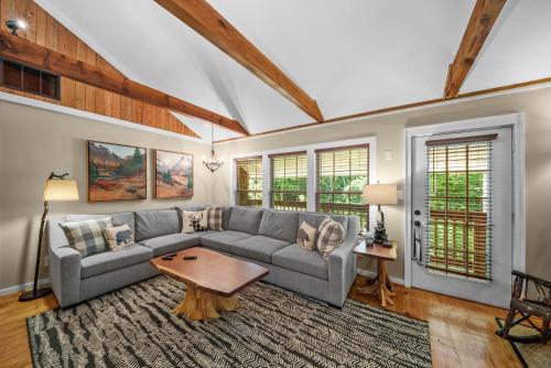 a living room with a couch and a table at Four Bear Falls in Banner Elk