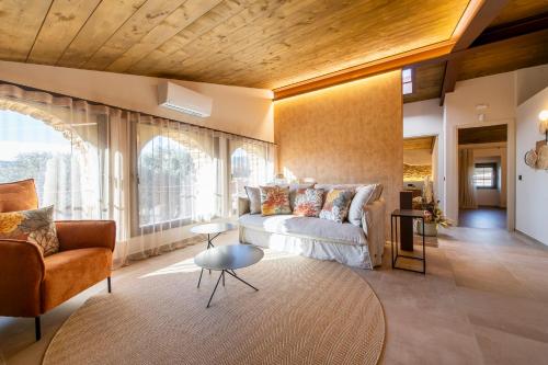 a living room with a couch and a table at Cannn Patllari de Corts I II in Cornellá de Terri