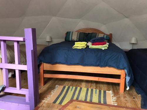 a bedroom with a bed in a tent at Chakana Newen Refugio in San Clemente