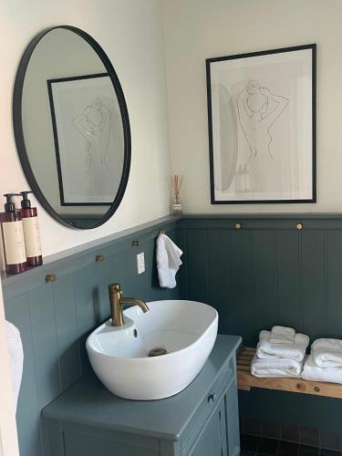a bathroom with a sink and a mirror at Als Kloster in Sønderborg