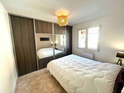 a bedroom with a large white bed in it at Large Family Chalet Mountain Views in Olette