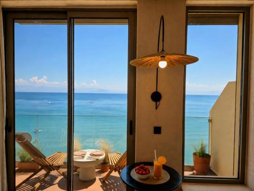 a living room with a view of the ocean at Ca' Mare luxury suite in Mesongi