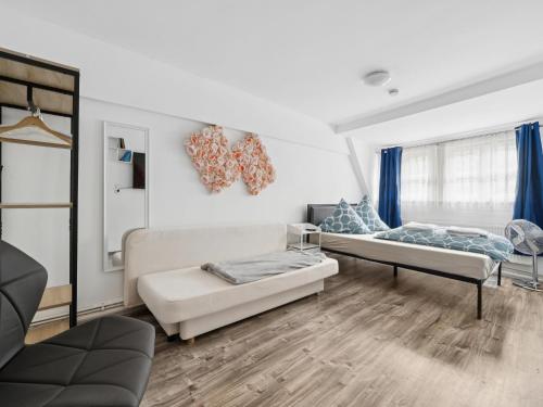 a living room with a couch and a bed at Auszeit in Goslar