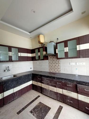 a bathroom with a sink and a counter top at The Olive County in Thirumurugan Poondi