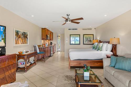 a large living room with a bed and a couch at Maui Eldorado Condo J221 in Kaanapali